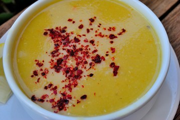 Turkish lentil soup topped with dried chili pepper flakes