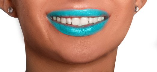 smile of young woman with white teeth and ultramarine lipstick 