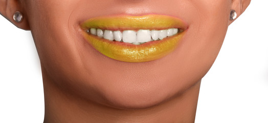 Obraz premium smile of young woman with white teeth and yellow lipstick 