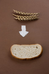 top view of the ears, the arrow of flour and a piece of bread. minimalism food flat lay