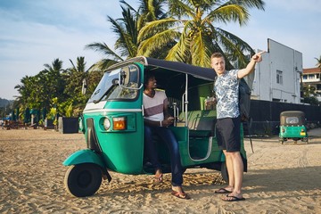 Traveling by tuk tuk taxi