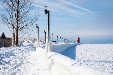 Light poles covered with ice on the pier walkway during the polar vortex in Grand Haven, Michigan.