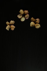 Photo of dried rose petals on a black background