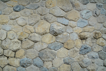 The old wall of stone blocks
