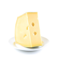 piece of Swiss cheese on white plate on white background