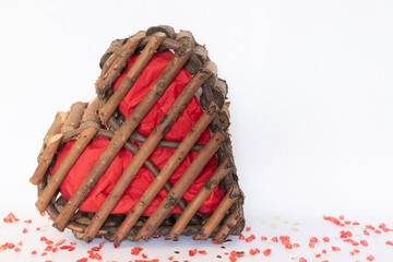 Red wood heart on white background