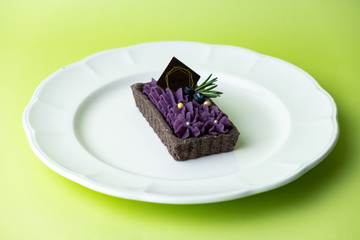Purple Sweet Potato Tart. Set on green background.