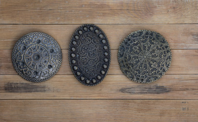 knight's shield on a wooden background