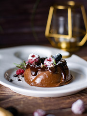 Chocolate cream mousse cake with fresh berries. delicious dessert.
