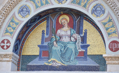 A colourful mosaic by Giuseppe Modena da Lucca, of the Saint Reparata, lunette above left door of...