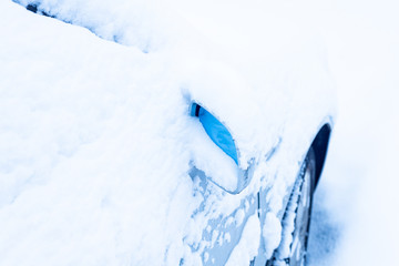 Car mirror after snowstorm