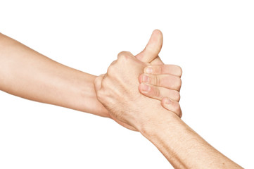The teenage hand helps the adult's hand to get out of trouble. Concept of help on a white background