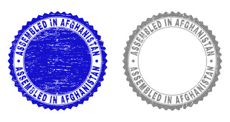 Grunge ASSEMBLED IN AFGHANISTAN stamp seals isolated on a white background. Rosette seals with distress texture in blue and grey colors.