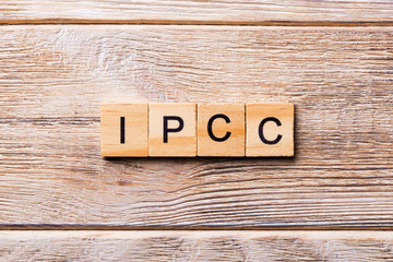 IPCC word written on wood block. abbreviation Intergovernmental Panel on Climate Change text on...
