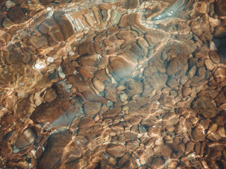 stones under sea water