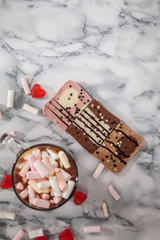 Handmade fine cappuccino with marmalade and marshmallows and decorated chocolate