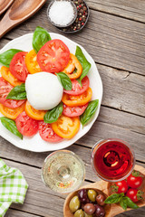 Caprese salad with rose and white wine