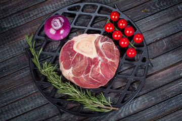  beautiful and juicy raw steak on the table with ingredients ready to roast