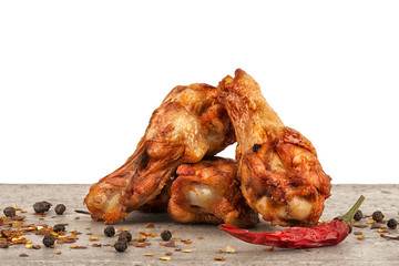 Chicken wings with red hot chili pepper, salt and peppercorn. Isolated on white background, copy space for your text or your image.