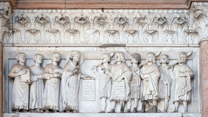 The right portal of the Cathedral of St Martin in Lucca. Lunette dedicated to the life of Saint...