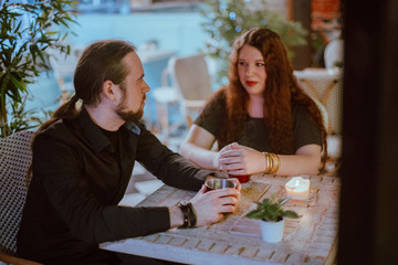 Couple in love on a date in a cafe over a cup of tea.