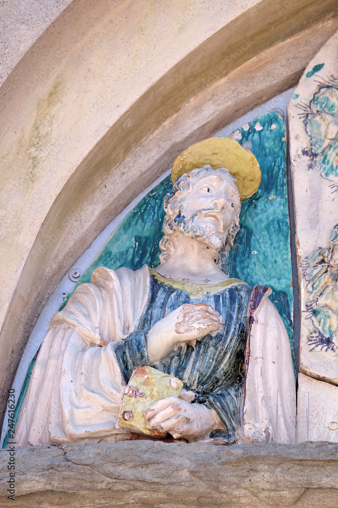 Wall mural saint on the portal of the saint joseph church in lucca, italy