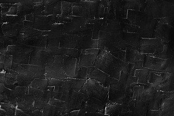 Dark texture of plaster wall. Marks after filling.