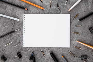 Artist home office desk workspace frame paint brushes and tools on gray background. Flat lay, top...