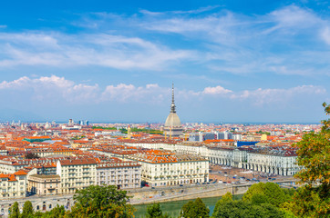 Fototapeta na wymiar Aerial top panoramic view of Turin city center skyline with Piazza Vittorio Veneto square, Po river and Mole Antonelliana building with high spire, blue sky white clouds background, Piedmont, Italy