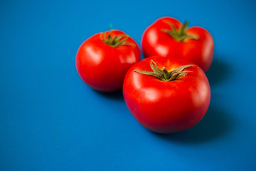 Tomatoes on a blue background