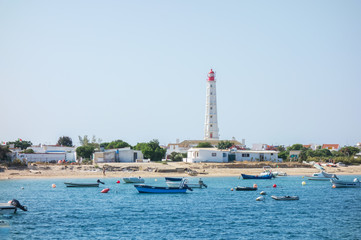 ALGARVE, PORTUGAL. AUGUST, 15 - 2018: .Lighthouse of the Farol island from the sea. In Formosa...