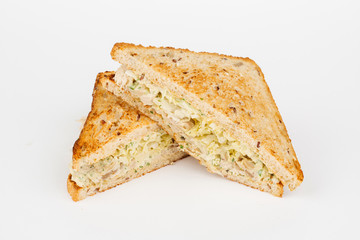 Tasty sandwich with slices of chiken, cheese and fresh organic vegetables