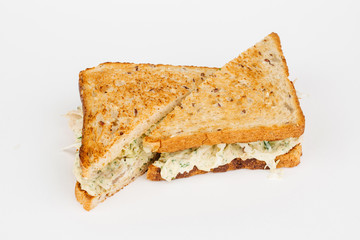 Tasty sandwich with slices of chiken, cheese and fresh organic vegetables