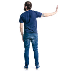 Man in jeans rejects on white background isolation, back view