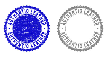 Grunge AUTHENTIC LEATHER stamp seals isolated on a white background. Rosette seals with grunge texture in blue and gray colors. Vector rubber imitation of AUTHENTIC LEATHER text inside round rosette.