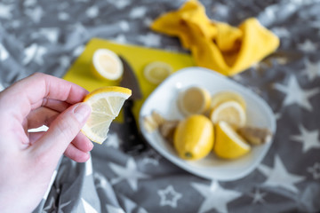 Eating a slice of lemon in bed