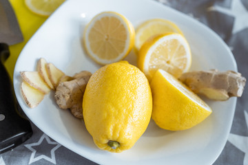 A bowl with fresh lemons and ginger