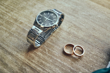 different accessories of a businessman for creating a style of a people lie on a wooden background