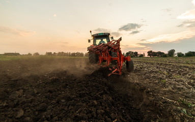 Tractor plowing fields