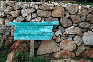 blue pointer over a background of stones