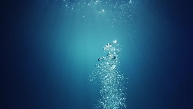 Sun Light Beams Shining From Above Coming Through The Deep Crystal Clear Blue Water Causing A Beautiful Water Lighting Reflections Curtain With Air Bubbles Rising Up To The Surface