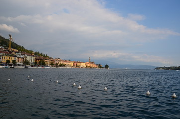 A large, ideally blue lake washes the shores of an Italian town.