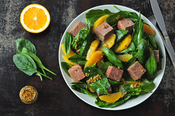 Healthy colorful salad with smoked salmon, spinach and orange. Fish salad with orange. Keto diet. Keto lunch The concept of a healthy diet and a beautiful body.