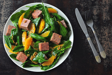 Healthy colorful salad with smoked salmon, spinach and orange. Fish salad with orange. Keto diet. Keto lunch The concept of a healthy diet and a beautiful body.