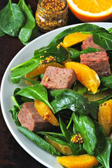 Healthy colorful salad with smoked salmon, spinach and orange. Fish salad with orange. Keto diet. Keto lunch The concept of a healthy diet and a beautiful body.