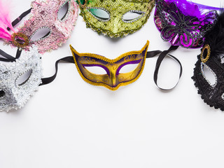 Colorful carnival masks on white background
