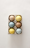 Colored eggs in cartons