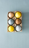 Colored eggs in cartons