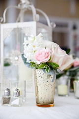 flowers in a vase at a wedding