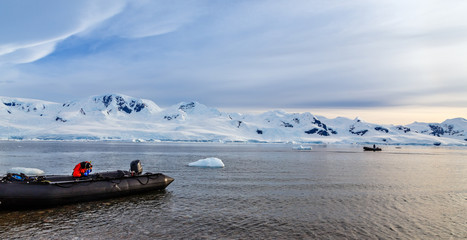 Zodiacs boats in the snow fjord of Neco bay, Antarctica